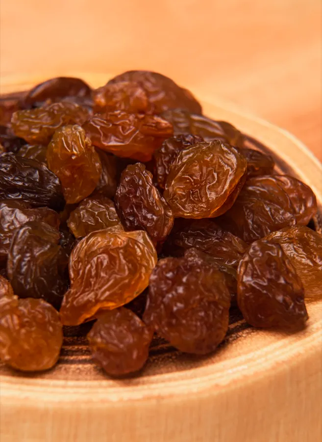 Malayer raisins on a wooden board